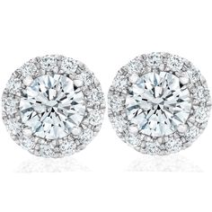 pair of white gold diamond earrings with round halos and pave diamonds on each side