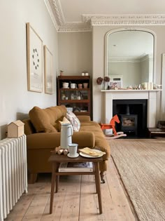 a living room filled with furniture and a fire place