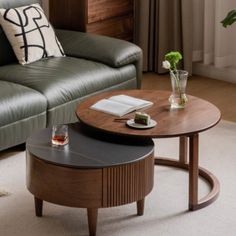 a living room scene with focus on the coffee table and leather sofa in the background