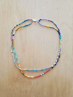 Bead Woven Necklace, Multicolor Single Strand Bead Choker, Multicolor Single Strand Beaded Choker, Handmade Multicolor Double Strand Beads, Adjustable Multicolor Double Strand Beaded Necklaces, Multicolor Double Strand Beaded Necklace For Beach, Adjustable Double Strand Colorful Beaded Necklace, Multicolor Double Strand Jewelry With Tiny Beads, Adjustable Double Strand Beaded Necklace With Tiny Beads