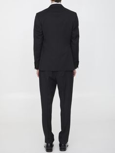 Two-piece suit in black wool. The jacket features classic lapels with brooch on lapel, single-breasted closure, two front welt pockets, a welt pocket on chest and buttoned cuffs. Straight-leg trousers with zip and button closure, two side welt pockets, two rear buttoned welt pockets and belt loops. Regular fit. The model is 184cm tall and wears size IT 50.Size nationality: IT Product number: 6734827 Product code: EQ7754SK62403999 Composition: 100% WOOL Classic Double-breasted Suit With Hidden Button Closure, Double Breasted Tuxedo Suit For Workwear, Timeless Formal Suits With Double Button Closure, Classic Tailored Double Breasted Suit With Hidden Buttons, Classic Tailored Double-breasted Suit With Hidden Buttons, Timeless Double Button Formal Suits, Classic Semi-formal Pantsuit With Double Button Closure, Semi-formal Classic Pantsuit With Double Button, Classic Single-breasted Semi-formal Pantsuit