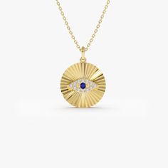 Introducing our 14k gold Diamond and Sapphire Ballerina Evil Eye Disc Necklace, a stunning piece of jewelry. The round disc pendant features diamonds and sapphires in the shape of a protective evil eye motif. The diamond-cut ballerina-inspired design adds an element of grace and elegance. Crafted from high-quality 14k gold, this necklace is perfect for special occasions. The intricate detailing ensures that this piece will be cherished for years to come. Order now to experience the epitome of luxury jewelry. ▶ Item Details * Made to Order * Gold Kt: 14K (also available in 18K) * Available Gold Colors: Rose Gold, Yellow Gold, White Gold * Length & Width: 14 x 14 MM * Round Diamond: 12 Pcs 1.2 MM * Diamond Carat Weight: 0.12 ctw * SapphireCarat Weight: 0.03 ctw * Diamond Color-Clarity: G Col 14k Gold Medallion Jewelry Gift, Yellow Gold Medallion Jewelry Gift, Gold Plated Medallion Jewelry For Formal Occasions, 14k Stamped Round Cut Jewelry For Gift, Gold Plated Yellow Gold Medallion Jewelry, Gold Medallion Jewelry For Anniversary, Sterling Silver Gold Jewelry For Celebration, Gold Sterling Silver Jewelry For Celebration, 14k Gold Hallmarked Medallion Jewelry