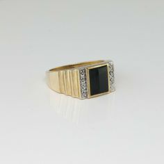 10K Yellow Gold Black Onyx and Diamond Ring, 10 round diamond white gold sets, with rectangular 8x10mm black onyx center 3/8 inch across, Ring size 11, Circa 1950, 6.5 grams SKU # BB287MR20 This listing contains photographs of the actual item you will receive. Our items are in excellent condition with little or no signs of wear and many are one of a kind pre-owned estate finds. Please look closely at the pictures in this listing as they are part of the product description. Please read the descri Classic Black Jewelry With Center Stone, Classic Black Rings For Anniversary, Classic Black Diamond Ring Jewelry, Classic Jewelry Ring With Black Diamonds, Classic Black Jewelry With Black Diamonds, Timeless Black Jewelry With Center Stone, Classic Black Diamond Ring With Black Enamel, Formal Black Jewelry With Diamond Accents, Classic Black Onyx Diamond Ring