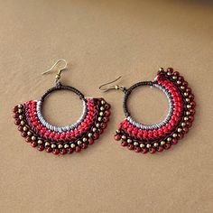 Macrame Boho Earrings Add a pop of boho style to your outfit with these stunning macrame boho earrings! The intricate knotting technique creates a unique and eye-catching design that is sure to turn heads. Featuring beautiful red, grey, brown and bronze colors, these earrings will complement any look. Handcrafted with care, these earrings are comfortable to wear all day long. Upgrade your accessory game with these must-have macrame earrings.  Made of macrame and high quality brass. A pair of ear Festival Macrame Jewelry, Traditional Macrame Earrings, Bohemian Macrame Tassel Earrings, Red Bohemian Macrame Jewelry, Bohemian Macrame Hoop Earrings, Festival Adjustable Macrame Beaded Earrings, Adjustable Macrame Beaded Earrings, Adjustable Macrame Beaded Earrings For Festival, Bohemian Handwoven Earrings