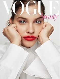 a woman with red lipstick on the cover of a magazine