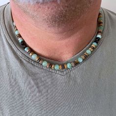 "Stone Beaded Necklace for Man, Gemstones necklace for man, Surfer Necklace, Beach Lovers Gift, Unique Gift for Men Waterproof Necklace A special necklace of gems in the colors of water and sand, made of gems in turquoise, green, and shades of brown. A beautiful necklace made of fine gemstones in size 6 mm, threaded on a high-quality wax thread Looks great on men and women. A perfect necklace as a gift for a young man, surfers, or anyone who loves the sea ❤️ Perfect to keep or to give as a gift. Mens Necklace Length Chart, Boho Men Jewelry, Men’s Beaded Necklace, Turquoise Jewelry Mens, Waterproof Necklace, Men Necklaces, Necklace Length Chart, Mens Beaded Necklaces, Men's Necklaces