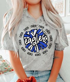 Introducing the Eagles Cheer DTF Transfer, perfect for any fan looking for a unique and high-quality design for their t-shirt! Rely on Rustic Grace, the #1 online store for heat transfer designs and vinyl transfers, to deliver a product that will exceed your expectations. Our DTF transfer process ensures that the full-color design is vibrant and long-lasting, without cracking or fading over time. Made with only the highest quality materials, these transfers are guaranteed to look great on any t- Middle School Cheer Shirts, Blue Graphic Print Top For Cheerleading, Blue School Spirit T-shirt With Sublimation Print, Blue School Spirit Sublimation T-shirt With Graphic Print, Blue T-shirt With Sublimation Print For School Spirit, Blue Graphic Print Sublimation Design For School Spirit, Blue Sublimation Design Shirt With Graphic Print For Fans, Blue Graphic Print Sublimation Design For Fan Gear, Blue Graphic Print Sublimation Fan Gear