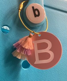 a close up of a name tag on a blue surface