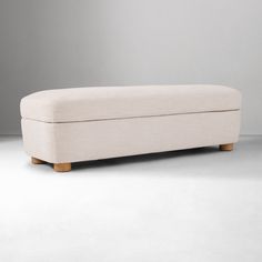 a white bench sitting on top of a gray floor