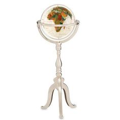 a small white globe on a stand with an orange and green map in the center