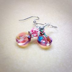 Handmade earrings designed to put a smile on your face every time you put them on. Made using surgical steel ear wires I use wrapped loops to give a finished look. Earrings come with rubber ear backs that slide on to keep earrings from falling out of ears. Color: Antique silver, pink glass pearl, pink glass crystal YOU MAY ALSO LIKE: https://www.etsy.com/shop/JillsHandmadeStuff?search_query=pink+earrings {SHIPPING NOTE} All items are handmade with care after your order is placed. CURRENT ORDER P Pink Wire Wrapped Earrings For Gift, Pink Hypoallergenic Dangle Crystal Earrings, Czech Glass Crystal Earrings With Ear Wire, Pink Hypoallergenic Beaded Dangle Earrings, Hypoallergenic Pink Beaded Dangle Earrings, Hypoallergenic Pink Crystal Drop Earrings, Pink Nickel-free Beaded Drop Earrings, Pink Crystal Dangle Earrings With Ear Wire, Pink Hypoallergenic Beaded Earrings For Gift