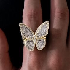 Introducing the Iced Butterfly Star Ring in 18k Gold Vermeil. This exclusive ring is a showstopper, featuring an iced out butterfly flooded in hand-set stones with our signature stars displayed on the side. Wear it anytime, anywhere- this piece is guaranteed to shine! This product is guaranteed for life – GLD will repair or replace the item should you experience any defects in craftsmanship or breakage. Don't know your ring size? Review our sizing chart below to find your best fit. Specification Yellow Gold Iced Out Jewelry Ring, Luxury Butterfly Ring With Cubic Zirconia, Luxury Cubic Zirconia Butterfly Ring, White Cubic Zirconia Butterfly Ring, Butterfly Shaped Yellow Gold Diamond Jewelry, Yellow Gold Butterfly Diamond Jewelry, Fine Jewelry Butterfly Ring In Diamond White Cubic Zirconia, Diamond White Cubic Zirconia Butterfly Ring, Diamond White Butterfly Ring With Cubic Zirconia