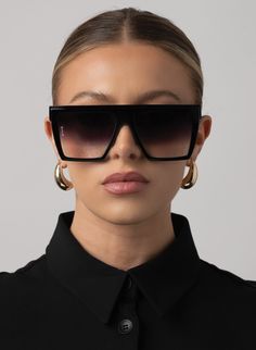 OVERSIZED FLAT TOP SHIELD SUNGLASSES IN BLACK WITH FADE LENS PRODUCT DETAILS Frame Shape: Oversized Flat top Frame Color: Shiny Black Lens Color: Gradient Black, Category 3 100% UV Protection Comes with a Protective Vegan Pouch SIZE MM INCHES FRAME WIDTH 148MM 5.8" FRAME HEIGHT 55.5MM 2.1" NOSE GAP 16MM 0.6" Black Oversized Sunglasses, Oversized Sunglasses Outfit, Black Sunglasses Women, Huge Sunglasses, Oversized Sunglasses Women, Oversized Fashion, Oversized Glasses, Big Sunglasses, Sunglasses Outfit