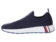 PRICES MAY VARY. This sporty knit slip on jogger sneaker by Tommy Hilfiger is both fashionable and comfortable. Closed Toe Slip on Closure Sporty Slip-on Running Shoes For Sports, Slip-on Sporty Running Shoes For Sports, Cushioned Athletic Fit Slip-on Sneakers For Jogging, Sporty Cushioned Slip-on Sneakers, Sporty Slip-on Sneakers With Athletic Fit, Sporty Slip-on Sneakers For Sports, Athletic Fit Slip-on Sneakers For Jogging, Breathable Low-top Slip-on Sporty Sneakers, Athleisure Slip-on Running Shoes With Rubber Sole