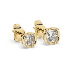 Indulge in the timeless beauty of our Cushion Cut Diamond Studs. These exquisite earrings are crafted in 14k gold with a bezel setting, featuring cushion-cut diamonds ranging from 0.10 to 0.50 ct. With their classic solitaire design, these diamond studs make a perfect jewelry gift for any occasion, radiating elegance and sophistication. Alternatively, choose from our options of lab-grown diamonds or dazzling moissanites at three different price points to fit your unique preferences and budget. Please check below to see specifications of each stone option. All our pieces come with Azalea Certification and Warranty document.  Independent appraisals cost an additional $60. All pieces over $2,000 come with free appraisal. M A T E R I A L & L E N G T H Available in 14k Yellow Gold, 14k Rose Gol Classic Yellow Gold Diamond Earrings With Bezel Setting, Classic Yellow Gold Earrings With Bezel Setting, Classic Yellow Gold Diamond Earrings With Halo Design, Cushion Cut Diamond, Solitaire Studs, Gold Diamond Jewelry, Cushion Cut Diamonds, Solitaire Diamond, Special Jewelry