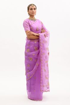 Purple saree in silk organza base with rose buds embellishment and hand embroidered gota patti jaal and scalloped border. Paired with pure silk blouse and matching modal satin petticoat.
Components:3
Embroidered
Neckline:Round
Sleeve Length:Half
Fabric:Pure Silk Organza, Pure Raw Silk, Pure Modal Satin; Lining: Cotton
Color:Purple
Scalloped saree and sleeves hem
Floral motif embroidery
Rose bud motifs embellished
Closure: Blouse: Concealed zipper - Aza Fashions Scalloped Saree, Embroidery Rose, Motif Embroidery, Purple Saree, Scalloped Border, Blouse Purple, Embroidered Saree, Rose Bud, Rose Embroidery