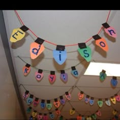 there are many colorful letters hanging on the wall