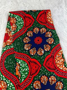 This Multicolor African Fabric is high quality African print made from 100% cotton and it's 45 inches wide. It is used for making African Clothing, African quilts, & For Home decoration. FYI: Print is Double sided. The listing is for 1, 6 yards and Headwrap Each piece of fabric measures:  36in by 45in for 1 yard 216in by 45in for 6 yards 70in by 22in for Head wrap If you purchase more than one yard, you will receive one continuous piece. *If you require more than what I have listed, feel free to send me email. CARE INSTRUCTIONS: *DO NOT BLEACH *Hand wash with cold water and mild soap or Dry clean *Press with hot iron for a crispy look. Color may be different due to your monitor Orange Ankara Fabric With Batik Print, Printed Orange Ankara Fabric, Multicolor Batik Print On Ankara Fabric, Multicolor Bohemian Cotton Fabric, Multicolor Floral Print Cotton Fabric, Vibrant Print Patterned Cotton Fabric, Bohemian Multicolor Cotton Fabric, Cotton Fabric With Vibrant Multicolor Print, Vibrant Print Cotton Fabric