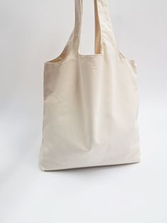 a white tote bag sitting on top of a table