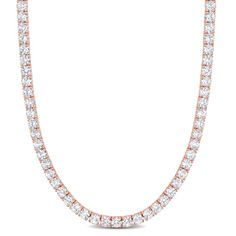 Dazzle with glory with this Created White Sapphire Tennis Necklace. Crafted in rose plated sterling silver, this shining necklace features 103 round-cut created white sapphire gemstones (4x4mm) in a tennis pattern for a regal look. This adjustable necklace measures 17-inches in length along with a 3-inch extension, secures with a lobster clasp and is perfect for layering with other necklaces. Enhanced with a high polished finish, this gift worthy necklace is a sparkling addition to any jewelry c Rose Gold Round Tennis Necklace As A Gift, Rose Gold Tennis Necklace With Diamond Accents, Rose Gold Diamond Tennis Necklace For Anniversary, Rose Gold Diamond Tennis Necklace With Accents, Anniversary Rose Gold Diamond Tennis Necklace, Rose Gold Brilliant Cut Tennis Necklace For Anniversary, Anniversary Rose Gold Brilliant Cut Tennis Necklace, Rose Gold Fine Jewelry Tennis Necklace, Rose Gold Round Tennis Necklace