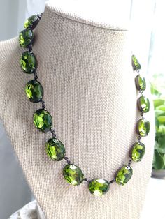 "Lovely green olivine oval stones are like a ring of crystallized mossy green forest around your neck. Each stone hand set and hand linked with high quality findings. Made to last a lifetime. Adjustable from 16 to 18\" with lobster claw and extender. stones are 18x13mm Beautiful for layering. Inspired by georgian collets. Gift boxed Find more to layer here : Www.sacredcake.etsy.com" Bridgerton Ball, Ruby Kyanite, Necklace Art Deco, Mossy Green, Necklace Art, Anna Wintour, Art Deco Necklace, Green Jewelry, Ball Necklace