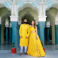 Menswear:- Faux Georgette Kurta set in yellow color. Lehenga Choli:- Readymade Faux Georgette Lehenga in Yellow,This attire with Cotton Lining is Enhanced with Fancy Tassels, Resham and Mirror Work, Available with a Faux Georgette Yellow Choli Crafted in Sleeveless and Round Neck and a Organza Dupatta in Yellow.The Choli and Lehenga Lengths are 14 and 42 inches respectively. Do Note: Accessories shown in the image are for presentation purposes only. (Slight variation in actual color vs. image is Yellow Gown With Resham Embroidery For Diwali, Yellow Zari Work Sets For Festive Occasions, Yellow Sets With Gota Work For Eid, Traditional Drape Yellow Gown For Eid, Yellow Gown With Traditional Drape For Eid, Festive Yellow Zari Work Sets, Festive Yellow Sets With Zari Work, Festive Yellow Set With Resham Embroidery, Yellow Saree Gown For Eid