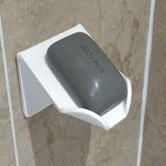 a close up of a soap dispenser on a wall