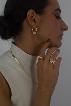 The classic gold hoop reinvented. Crafted in high polish 18K Gold vermeil with sterling silver accent, the Greyson hoops are a staple in the Hydez Essential Collection. These sophisticated head-turners will luxe up any look. Our two tone design means you’ll never have to choose between gold and silver.Materials: 18K Gold Vermeil and Sterling SilverDimensions: 20mm hoop, 3mm width What is 18K Gold Vermeil?: 3 microns of 18K Gold over Sterling Silver. Vermeil is far more durable to wear than tradi Luxury Hammered Gold Hoop Earrings, Luxury Gold Hammered Hoop Earrings, Luxury Gold Diamond Cut Huggie Earrings, White Gold-plated Hoop Jewelry, Timeless Yellow Gold Sterling Silver Huggie Earrings, White Gold Plated Hoop Jewelry, Everyday Luxury Gold Plated Huggie Earrings With Polished Finish, Timeless Gold Diamond Cut Huggie Earrings, Gold Tarnish-resistant Rings For Everyday Luxury