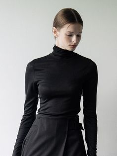 Composition : Wool 28%, rayon 66% polyurethane 6%Color : blackCountry of Origin : Republic of Korea Black Turtleneck T-shirt For Fall, Sleek Fine Knit Tops For Fall, Elegant Second-skin Tops For Night Out, Modern Black T-shirt For Fall, Black Elastane Tops For Winter, Black Elastane Top For Winter, Classic Black Turtleneck Top, Classic Black Fine Knit Top, Classic Black Tops