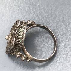 We take pride in finding unique , quality ~ Antique /Vintage jewelry pieces which are carefully hand picked by us so that you can add them to your treasure/ collection or gift to someone you love ~ We try to add plenty of items every week and have been selling online for more then 10 years . Vintage Middle eastern e fine filigree box silver ring featuring with beautiful details Unmarked but acid test positive for silver (atleast 800 silver ) . Measurements : Adjustable Ring size ~Without any adj Ceremonial Antique Rings With Antique Finish, Ceremonial Antique Finish Jewelry Ring, Ceremonial Ring With Antique Finish, Ceremonial Antique Finish Ring, Vintage Silver Filigree Ring, Antique Engraved Open Ring For Ceremonial Occasions, Antique Engraved Filigree Ring For Ceremonial Occasions, Antique Open Ring For Ceremonial Occasions, Antique Handmade Filigree Ring