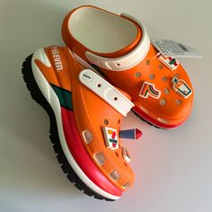 Nwt, Never Worn, Ready For Fast Shipping. Chunky Platforms With Light Up Jibbitz Charms. Limited Edition Casual Multicolor Platform Clogs, Orange Synthetic Casual Clogs, Orange Casual Synthetic Clogs, Casual Orange Synthetic Clogs, Casual Orange Clogs With Rubber Sole, Orange Synthetic Clogs With Round Toe, Sporty Closed Toe Clogs For Spring, Casual Orange Clogs With Round Toe, Spring Sporty Closed Toe Clogs