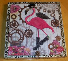 a pink flamingo is standing in front of gears and flowers