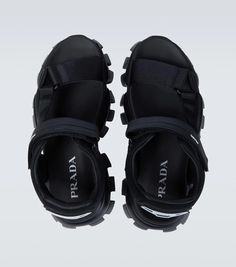 These tank sandals from Prada are made in Italy with woven fabric straps, featuring VELCRO® fastenings, chunky rubber soles, and a rubberized logo at the heel counter..Closure: VELCRO®-fastening ankle strap.Lining: fabric.Made in Italy.Sole: fabric insole, rubber sole.Toe shape: round open toe.Upper: fabric.True to size.Half sizes please take the next size up.UK sizes.6,0cm-2.5' heel (size EU 42) Prada Cloudbust Thunder, Cloudbust Thunder, Prada Cloudbust, Prada Shoes, Mens Sandals, Personal Shopping, Lining Fabric, Color Names, Shoe Collection