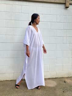 Unwind in absolute comfort with our semi sheer cotton gauze kaftan. This kaftan is perfect for the beach, pool, resort and laid-back time at home. Crafted from quality soft and breathable gauze cotton, it offers an airy fit that's ideal for lounging and cover up. Its relaxed design and easy slip-on style make it your go-to choice for outdoor cover up and relaxed nights at home. Beachy V-neck Cover-up With Relaxed Fit, Oversized White Cover-up For Loungewear, Long White Cover-up For Loungewear, Breezy V-neck Beach Dress For Loungewear, White Beachy Cover-up For Loungewear, Beach Linen Kaftan, Linen Kaftan For Beach, White Maxi Kaftan For Loungewear, White Linen Beach Dress Cover-up