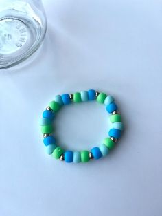 a simple pony bead bracelet Casual Turquoise Stretch Bracelet With Colorful Beads, Casual Blue Beaded Bracelet With Large Beads, Blue Tiny Beads Stretch Bracelet For Friendship, Casual Turquoise Spacer Beads, Casual Blue Stretch Bracelet With Large Beads, Blue Stretch Bracelet With Tiny Beads, Casual Turquoise Beaded Bracelets With Spacer Beads, Turquoise Beaded Bracelet With Spacer Beads, Turquoise Beaded Bracelets With Spacer Beads For Everyday