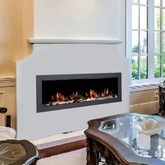 a living room filled with furniture and a fire place in the middle of the room