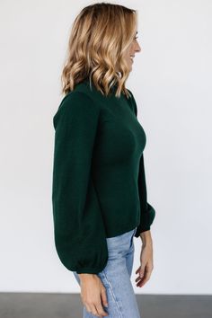 Dark emerald green color Soft knit material has stretch Turtleneck Sleeves widen near bottom Ribbed at neck, sleeve cuffs, and hem 57% Viscose, 27% Polyester, 17% Polyamide Casey is 5'8, cup size 32B, size 2 and wearing size S Trina is 5'6, cup size 32D, size 2 and is wearing size S Sierra is 5’8, cup size 37”, size 6/8 and wearing size M Green Stretch Long Sleeve Knit Top, Green Sweater With Ribbed Cuffs For Work, Green Fitted Knit Top For Fall, Fitted Green Knit Top For Fall, Stretch Green Knit Top For Winter, Green Stretch Knit Top For Winter, Chic Fitted Green Knit Top, Green Turtleneck Sweater With Ribbed Cuffs, Green Knit Top For Fall