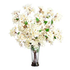 a vase filled with white flowers on top of a table