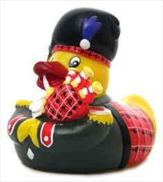 a rubber ducky with a hat and scarf on it's head, sitting in front of a white background