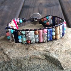 This multi color beaded bracelet for women is stunning and unique. This single wrap bracelet would compliment and outfit you want to wear it with. This bracelet would be a beautiful meaningful gift for your mother on Mother's Day. It will be a gift she can enjoy every day. This leather beaded bracelet is made with a variety of gemstone beads in various sizes and colors. Please choose the size you would like at check out. Artisan Beaded Multicolor Wrap Bracelet, Artisan Multicolor Beaded Wrap Bracelet, Beaded Wrap Bracelet For Gift, Adjustable Multicolor Artisan Wrap Bracelet, Multicolor Beaded Wrap Bracelet For Friendship, Multicolor Beaded Friendship Wrap Bracelet, Hand Wrapped Multicolor Crystal Bracelet, Multicolor Hand Wrapped Crystal Bracelet, Multicolor Round Beads Wrap Bracelet For Friendship