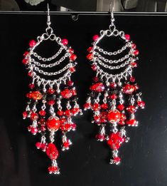 New Handmade Red colored glass crystal beads dangle beautifully from these Silver tone Hoops on stainless Steel ear wires. #hammerfamilyjewels Item D5-41 Red Crystal Dangle Chandelier Earrings, Red Crystal Chandelier Dangle Earrings, Red Czech Glass Beaded Earrings With Dangling Beads, Red Dangle Jewelry With Faceted Beads, Czech Glass Crystal Dangle Earrings For Party, Red Wire Wrapped Dangle Earrings, Red Crystal Dangle Earrings, Red Crystal Chandelier Earrings As Gift, Red Beaded Czech Glass Earrings