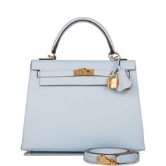 Photos are a representation of the bag sourced. This Kelly, in the Sellier style, is in Bleu Brume epsom leather with gold hardware and has tonal stitching, front flap, two straps with center toggle closure, clochette with lock and two keys a single rolled handle and removable shoulder strap.The interior is lined with Bleu Brume chevre leather and has one zip pocket with an Hermes engraved pull and one open pocket on the opposite side.Origin: FranceCondition: Pristine; new or never (plastic on h Evening Epsom Leather Bag With Lock, Evening Bags With Lock In Epsom Leather, Blue Epsom Leather Bag With Gold-tone Hardware, Gold Epsom Leather Bag With Lock, Chic Epsom Leather Bag With Lock, Top Handle Bags In Epsom Leather With Lock, Top Handle Epsom Leather Bag With Lock, Epsom Leather Top Handle Bags With Lock, Blue Bags With Lock For Formal Occasions