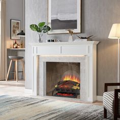 a living room with a fire place in the middle and a painting on the wall