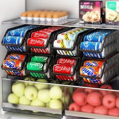 a refrigerator filled with lots of different types of drinks and food in it's bins