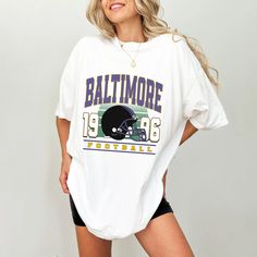 Get ready to cheer on the Baltimore Ravens in style! This shirt is perfect for game days, casual outings, or any day you want to support your favorite team.  Made from soft, high-quality material, it offers comfort and durability. Show your Ravens spirit with flair! Football T Shirt, Baltimore Md, Baltimore Ravens, Favorite Team, Baltimore, Favorite Outfit, Gender Neutral, Art Collection, Bathing Beauties