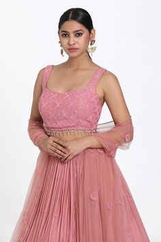 Onion pink lehenga featuring hand-embroidered cutdana, beads, and resham work. Paired with a padded blouse and a dupatta., Fit: Relaxed Pink Reception Dress With Cutdana Details, Pink Dress With Cutdana For Reception, Pink Sharara With Zari Work Sleeveless, Designer Sleeveless Pink Anarkali Set, Pink Sleeveless Semi-stitched Anarkali Set, Pink Sleeveless Lehenga, Pink Sleeveless Sets With Zari Work, Pink Sleeveless Lehenga With Resham Embroidery, Sleeveless Pink Lehenga With Resham Embroidery