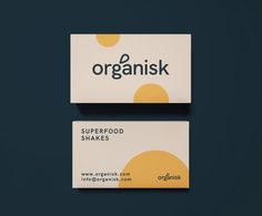 two business cards with the words organisk and superfood shakes written on them