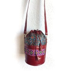 Box leather bags are artistically designed and totally handmade bags. This beautiful handcrafted bag is made with buffalo leather. The Kutch embroidery on the side of the bag and the fabric used in this bag give a unique whole look and make this bag super stylish. Very light-weighted and spacious enough to carry your stuff. It comes with detachable and adjustable straps. A beautiful bag for your vacations can style with your Maxi dresses or any outfit it will look perfect. Dimensions: Radius- 8c Traditional Bucket Bag With Adjustable Strap For Everyday, Traditional Shoulder Bag With Leather Lining, Bohemian Leather Bucket Bag With Removable Pouch, Leather Bucket Box Bag As A Gift, Traditional Leather Crossbody Shoulder Bag, Handmade Leather Bohemian Bucket Bag, Traditional Bucket Bag With Leather Handles For Daily Use, Leather Bucket Bag As Gift, Bohemian Leather Bucket Bag Handmade