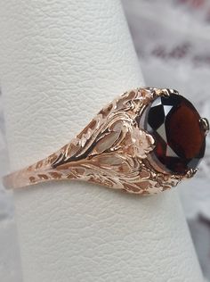 natural red garnet solitaire ring with swirl antique floral rose gold filigree Elegant Bronze Ring For Formal Occasions, Classic Rose Gold Rings With Intricate Design, Classic Rose Gold 14k Filigree Ring, Classic 14k Rose Gold Filigree Ring, Vintage Rose Gold Solitaire Ring, Classic Rose Gold Filigree Ring As Gift, Classic Rose Gold Filigree Ring Gift, Rose Gold Filigree Ring Gift, Rose Gold Filigree Promise Ring