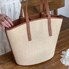 Add a summer-inspired touch to your accessories edit with this straw bucket tote bag. Woven from straw with leather trimmings, this handbag makes us look forward to summer and escapism. It comes with an open top and is roomy enough for all your essentials. Easy-to-wear wardrobe staples that combine classic and contemporary styles.Width (cm): 28 cmHeight (cm): 16 Color: Light brownInterior Material: Polyester CottonMaterial_bag: StrawBagType: Handbag & Shoulder bagBag Length: 28 cm Summer Bucket Bag With Double Handle For Daily Use, Summer Double Handle Bucket Bag For Shopping, Summer Shopping Bucket Bag With Double Handle, Chic Shoulder Bag With Bamboo Handle For Beach Season, Summer Tote Bucket Bag With Handles, Summer Top Handle Bucket Bag For Daily Use, Summer Tote Bucket Bag, Beige Bucket Beach Bag With Handles, Vacation Bucket Shaped Shoulder Bag With Leather Handles